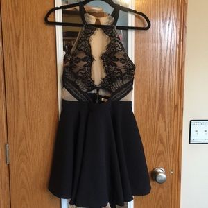 Halter top lace dress with cutout.